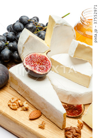 pile of brie or camambert cheese on white pile of brie or camambert cheese on white 37552971