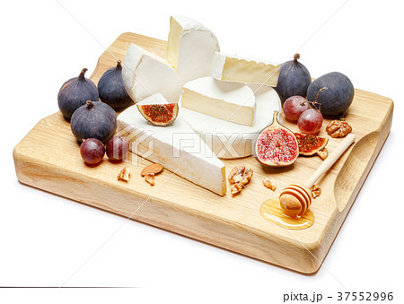 pile of brie or camambert cheese on white pile of brie or camambert cheese on white 37552996