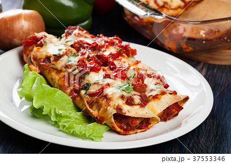 Traditional mexican enchiladas with chicken meat Traditional mexican enchiladas with chicken meat 37553346