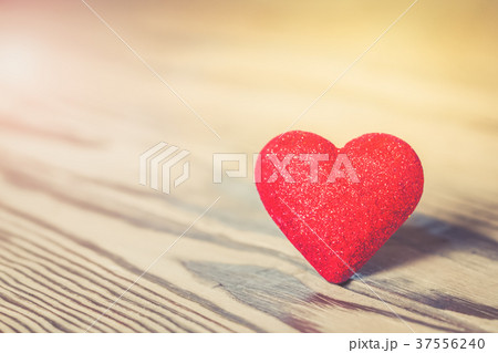 Red heart with glitter on wood 37556240