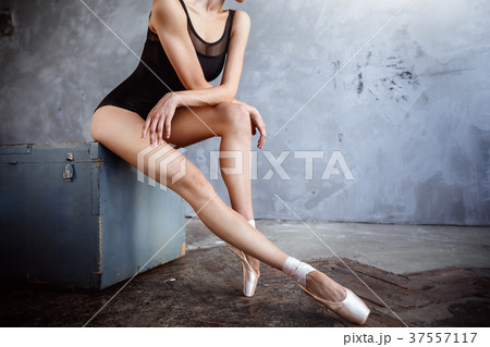 Young ballerina in dancing suit poses in studio 37557117