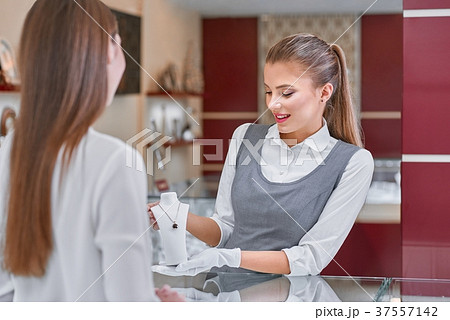 Blonde jewelry worker presenting a beautiful 37557142