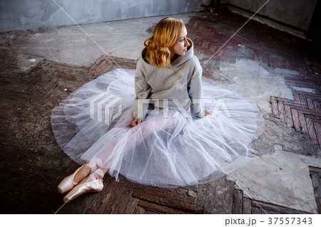 Young slim ballerina is posing in stylish studio 37557343