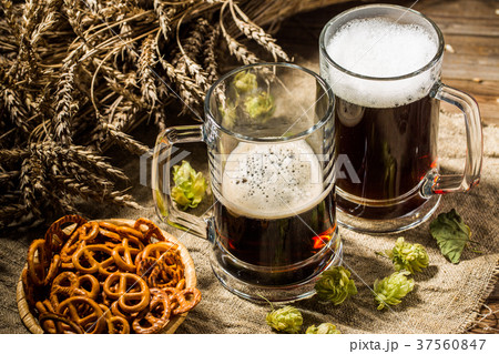 Two tankard beer with wheat and hops , basket of 37560847