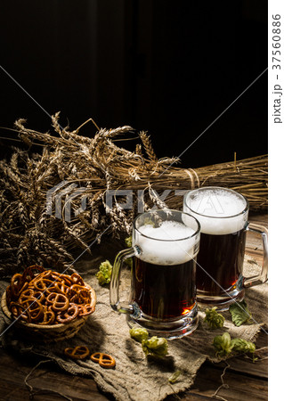 Two tankard beer with wheat and hops , basket of 37560886