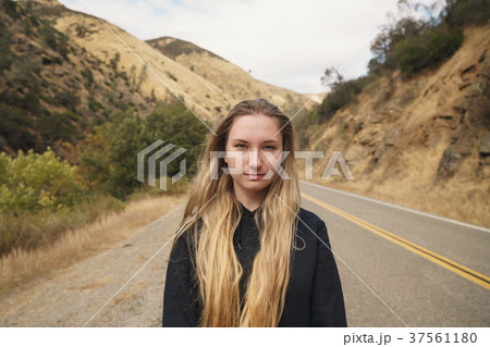 teen girl standing on road near merced river on 37561180