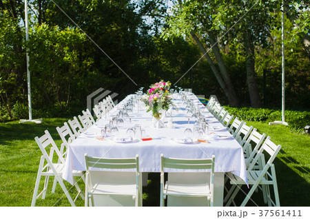 White and long art wedding table outdoors 37561411