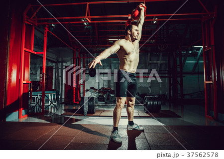 Fitness Kettlebells swing exercise man workout at Fitness Kettlebells swing exercise man workout at 37562578