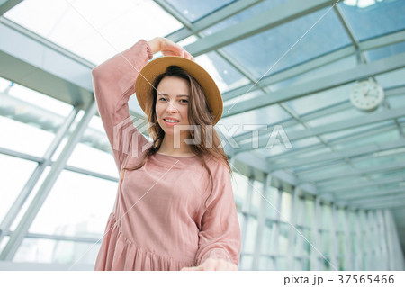 Portrait of young woman an airport lounge waiting Portrait of young woman an airport lounge waiting 37565466