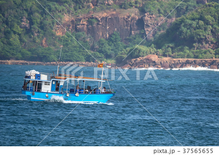 Asian fishermen in motor boat Asian fishermen in motor boat 37565655