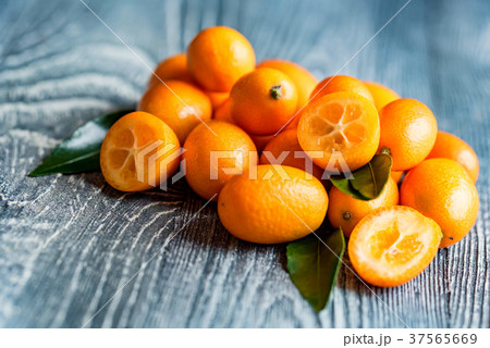 Kumquat or cumquat on wooden table 37565669