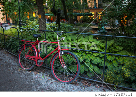 old red bike near the fence old red bike near the fence 37587511