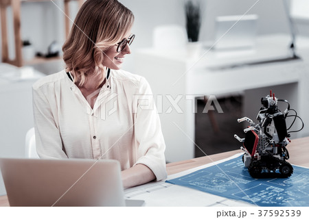 Confident brunette woman turning her head Confident brunette woman turning her head 37592539