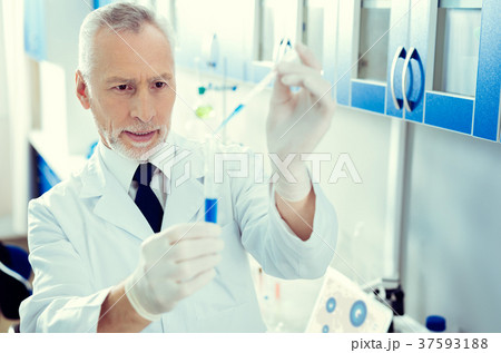 Focused researcher using pipette while working 37593188