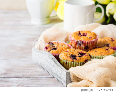 Berry muffins in wooden tray napkin breakfast Berry muffins in wooden tray napkin breakfast 37593744