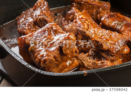 Pork spare ribs on dish in own sauce 37596042