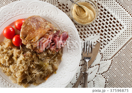 Pork knuckle with fried sauerkraut Pork knuckle with fried sauerkraut 37596875