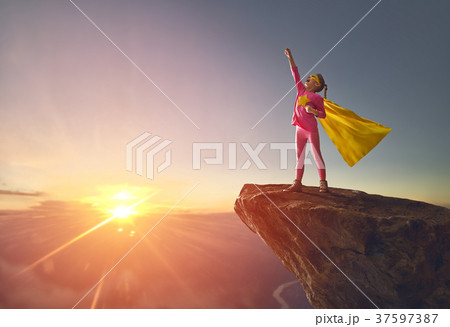 child is playing superhero 37597387