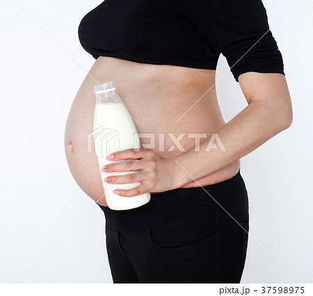 Belly of a pregnant woman. 37598975