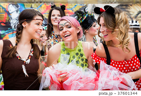 Group of women in sexy costumes at carnival party  37601344