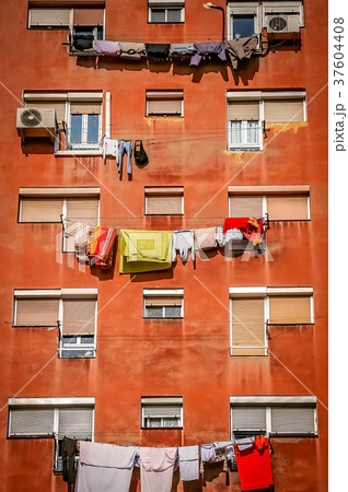 Laundry drying outside residential building 37604408