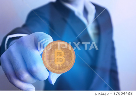 Man point finger to bit coin 37604438