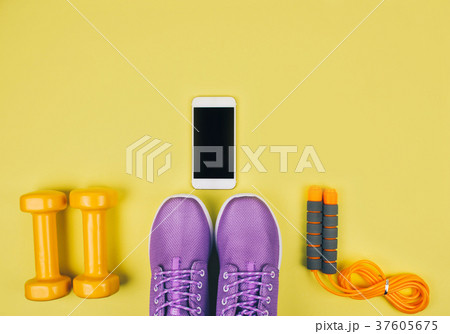 Flat lay shot of sneakers, dumbbells, jump rope or Flat lay shot of sneakers, dumbbells, jump rope or 37605675