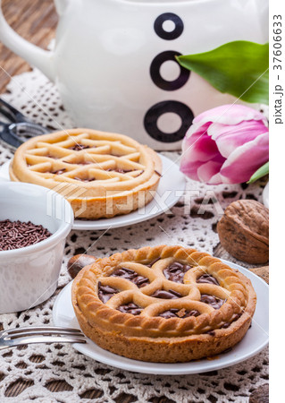 Tasty chocolate walnut tart. 37606633