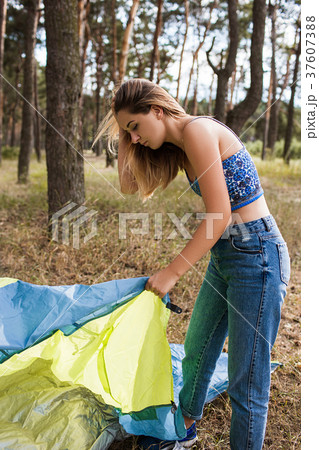 Hiker girl prepare tent nature tourism concept 37607388