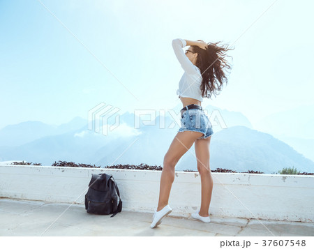 Beautiful young tourist girl with backpack at Beautiful young tourist girl with backpack at 37607548