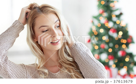 happy young woman or teenage girl at christmas happy young woman or teenage girl at christmas 37613679