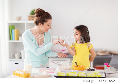 happy mother and daughter baking at home happy mother and daughter baking at home 37613852