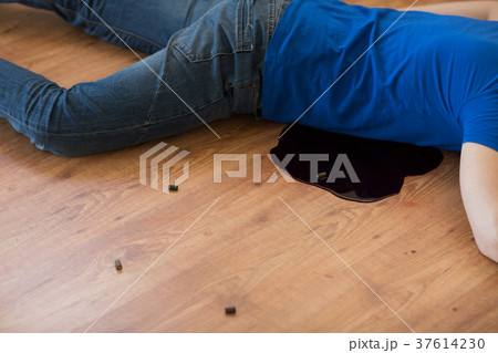 dead man body in blood on floor at crime scene 37614230