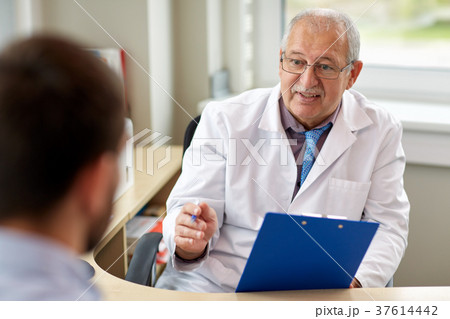 senior doctor talking to male patient at hospital senior doctor talking to male patient at hospital 37614442