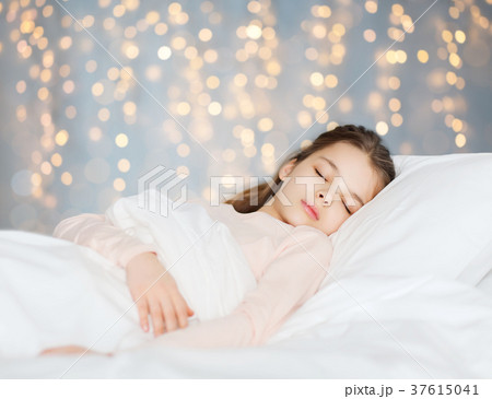 girl sleeping in bed over holidays lights girl sleeping in bed over holidays lights 37615041