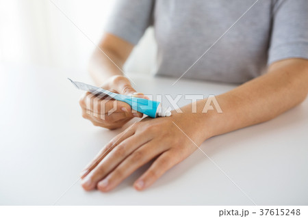 close up of hands with cream or therapeutic salve 37615248