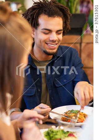 happy couple eating at restaurant 37615301