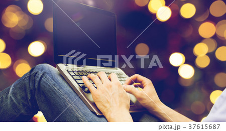 close up of man typing on laptop keyboard 37615687
