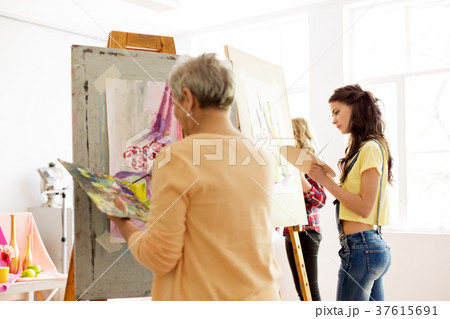 senior woman painting at art school studio senior woman painting at art school studio 37615691