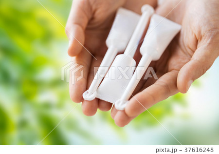 hand holding tubes of micro enema hand holding tubes of micro enema 37616248