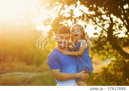 Father holds daughter on hands Father holds daughter on hands 37617688