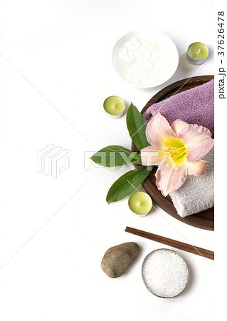 Spa setting of towel, flower on white background. Spa setting of towel, flower on white background. 37626478