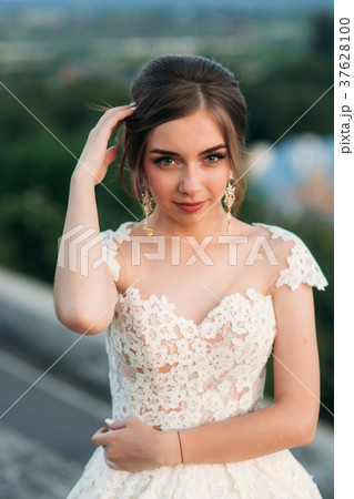 Young girl in wedding dress on city background at Young girl in wedding dress on city background at 37628100