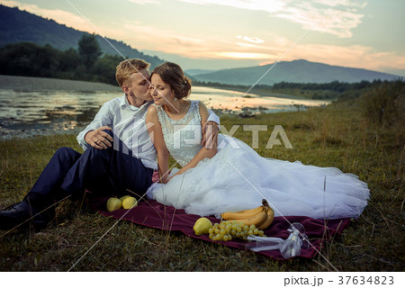 Sensitive portrait of the handsome groom kissing 37634823
