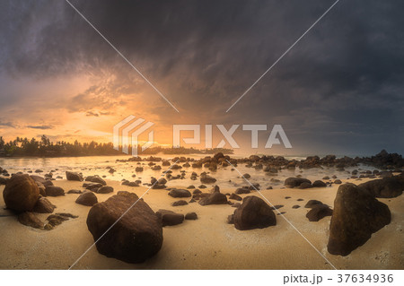 Tropical beach with rocks on sand coast of ocean Tropical beach with rocks on sand coast of ocean 37634936