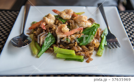 Stir fried flat noodle and shrimp Stir fried flat noodle and shrimp 37635969