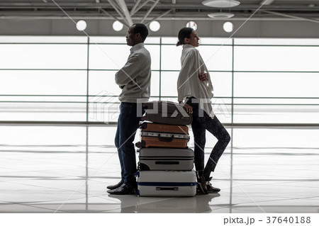 Young man and woman going to travel with luggage 37640188