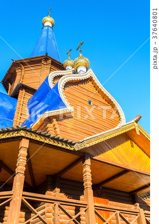 Traditional wooden orthodox church with domes  37640801