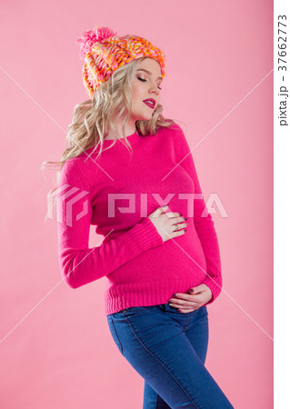 Portrait of blonde pregnant woman is wearing warm Portrait of blonde pregnant woman is wearing warm 37662773