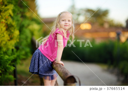 Cute little girl having fun in Lonato del Garda, a small town and comune in the province of Brescia 37665514
